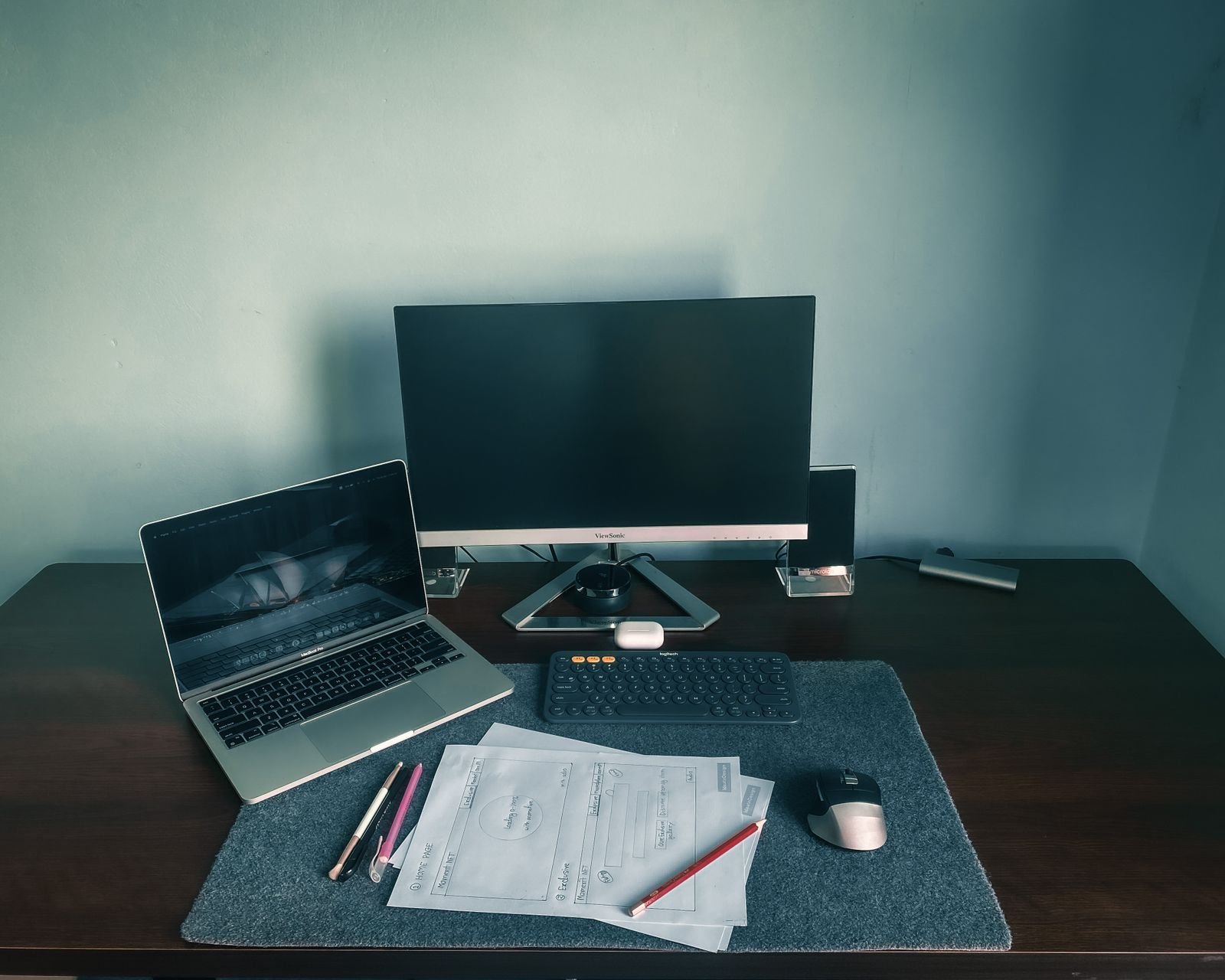 Desk with a laptop, monitor and peripherals